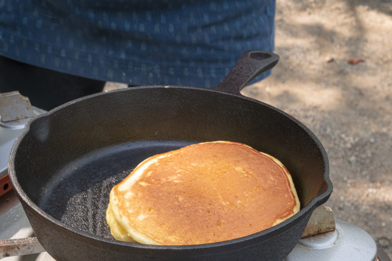 Cast iron pan baking and roasting pancake evenly with perfect browning on oven