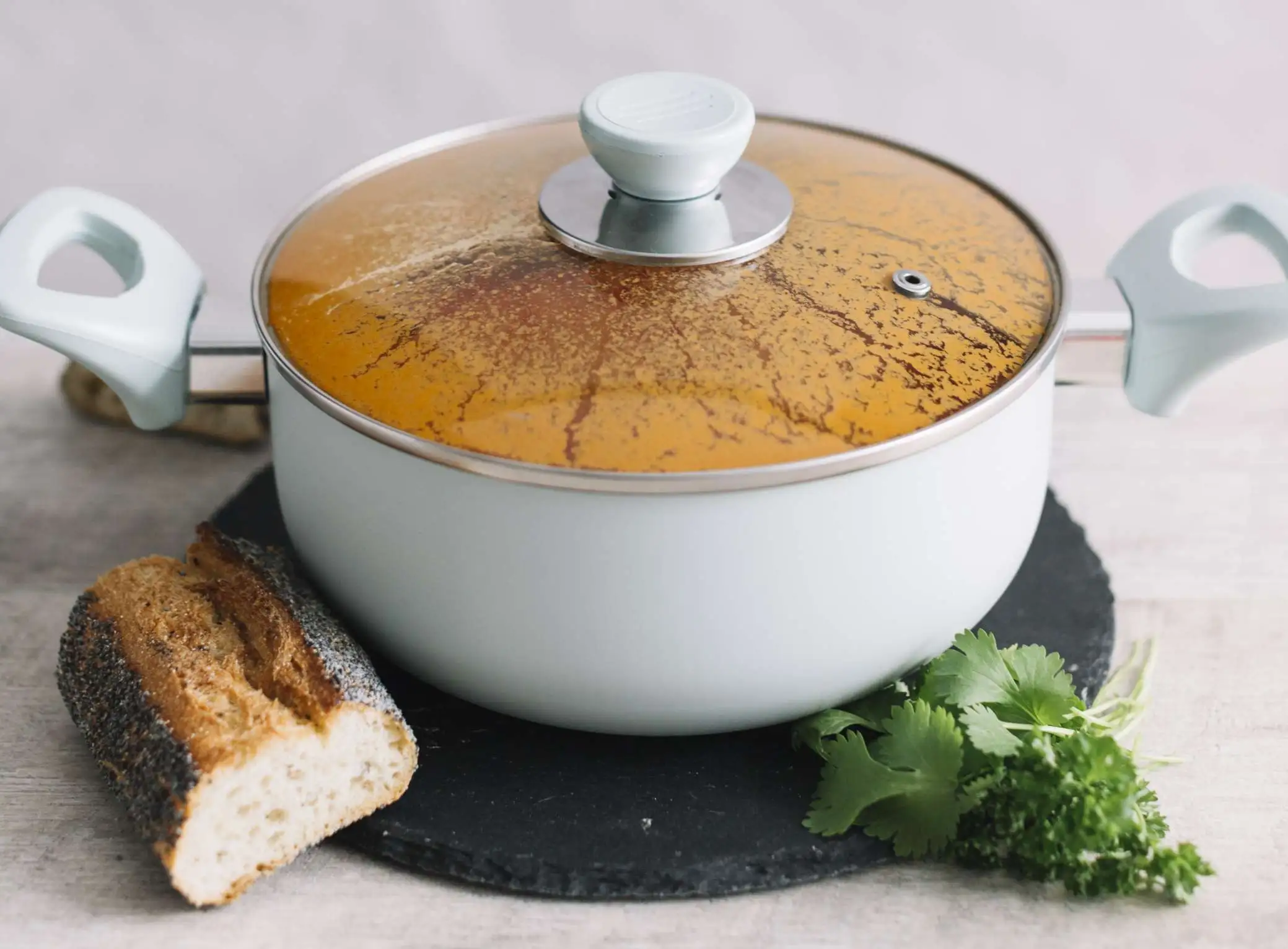 glass lid and plastic handle of a aluminum soup pot - KitchenGuidePro glass lid and plastic handle of a aluminum soup pot