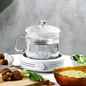 Heat resistant glass cooking pot with clear lid on modern stovetop